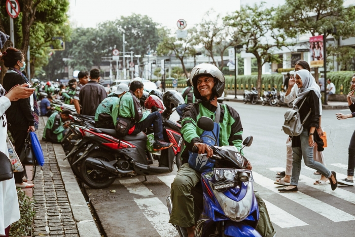 Gig workers on motorcycles