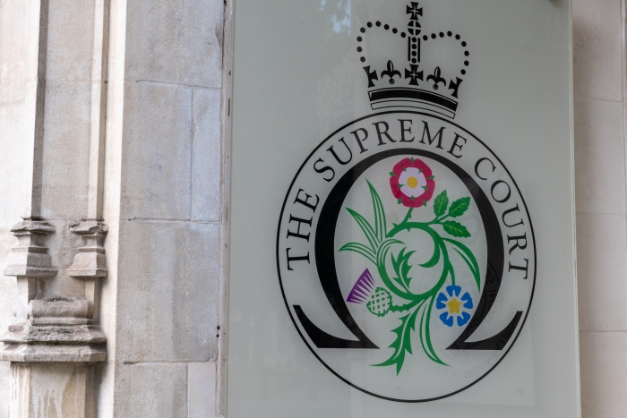the Supreme Court of England,Wales and Northern Ireland showing the building and the badge.