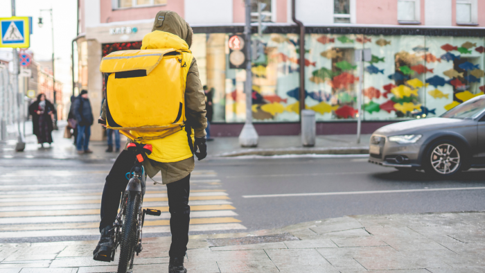 Delivery rider on a bike in the street