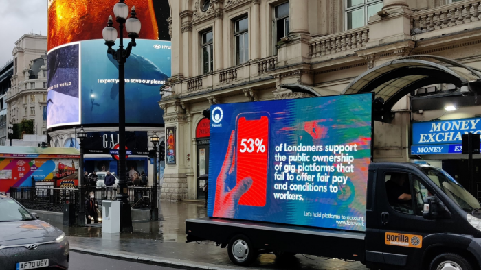 Van with billboard in front of Picadilly Circus