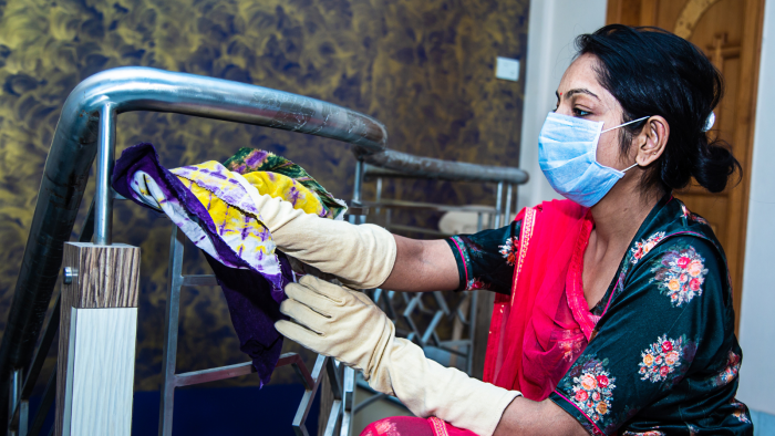 Woman cleaning with mask