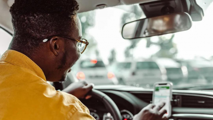 Driver looking at map on phone